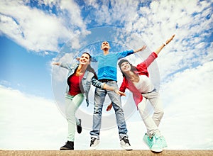 Group of teenagers spreading hands