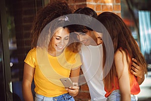 Group of teenagers on the street with CellPhones