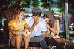 Group of teenagers on the street with CellPhones