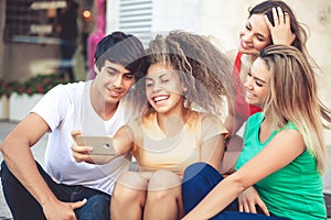 Group of teenagers on the street with CellPhones