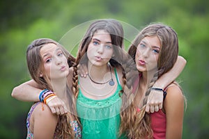 Group of teens blowing kisses