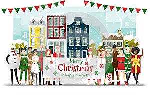 Group of teens in Christmas costume concept holding board with text Merry Christmas and Happy New Year