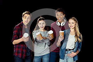group of teens with cups of coffee to go photo