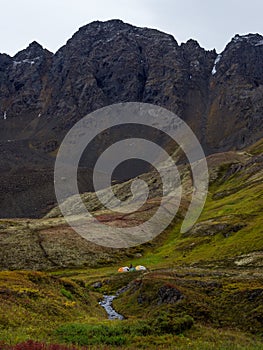 Group of Tents in Mountain Valley, Autumn in Alaska