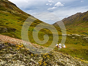 Group of Tents in Mountain Valley, Autumn in Alaska