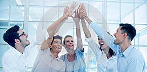 Group therapy in session sitting in a circle high fiving