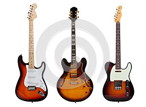 Group of three Electric guitars on white