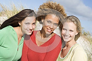 Group of three female friends at beach