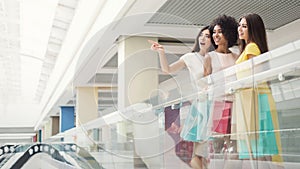 Group of three girls shopping together in mall