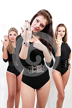Group of three ladies in black body suits