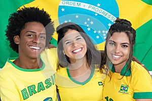 Group of three laughing brazilian soccer fans