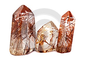 Group of three Mineral quartz rocks with rutile isolated on a white background
