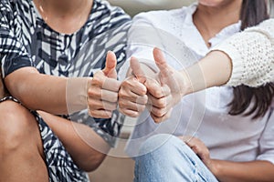 Group of Three young business partners woman showing thumbs up