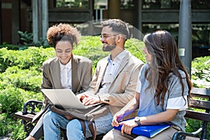 Group of three young business people experts in marketing telecommuting financial and strategy, talking outside office building.