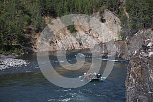 A group of tourists on the raft floated down the river.