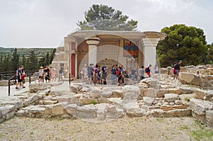 Group of tourists in the ruins of the palace of Knossos Greece, Crete,