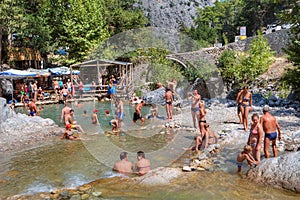 Group of tourists swimming in a mountain river canyon Kuzdere.