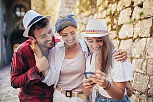 Group of tourists traveling and sightseeing using phone