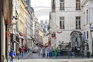 Group of tourists visiting Manneken Pis or Little Man Pee located near Grand Place in the city of Brussels, Belgium