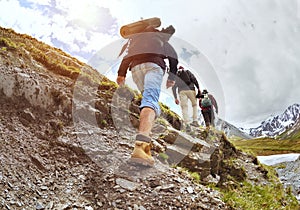 Group of tourists walking uphill by trek