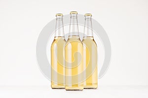 Group transparent longneck beer bottle 500ml with lager, mock up.