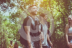 Group of traveler best friends walking together at rain forest,Enjoying backpacking concept