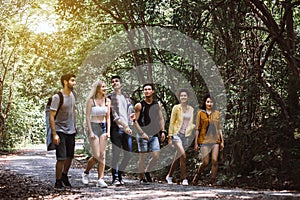 Group of traveler friends walking together at rain forest,Enjoying backpacking concept
