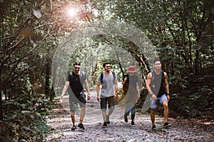 Group of traveler friends walking together at rain forest,Enjoying backpacking concept