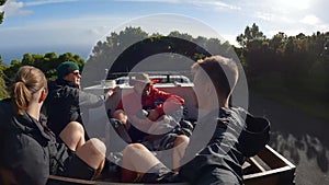 Group of travelers riding in the back of a pickup truck