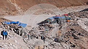 Group of trekkers arriving in remote village Gorakshep, the last stop before Mount Everest Base Camp in the Himalayas, Nepal.