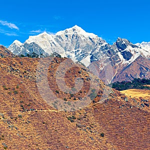 Group of trekkers moves up slowly along the mountain path towards Everest view point. Solu Khumbu, Sagarmatha NP, Nepal