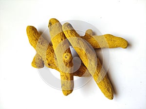 Group of Turmeric Roots isolated in a white Background. Turmeric is a spice comes from the turmeric plant. It is commonly used in