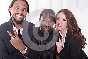 Group of two africans and one caucasian girl