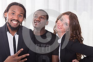 Group of two africans and one caucasian girl photo