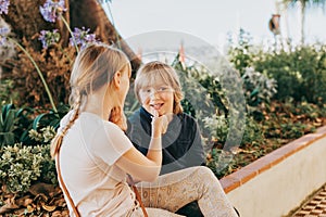 Group of two funny kids playing together outside