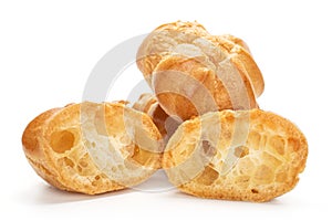 Golden baked profiterole isolated on white photo