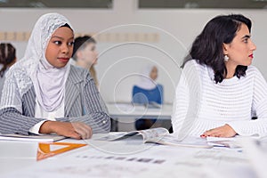 Group of  university architecture students working on practice lessons. Looking for solution during class