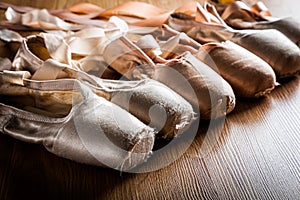 A group of used ballet slipper or pointe shoes