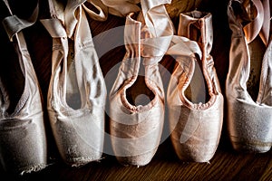 A group of used ballet slipper or pointe shoes