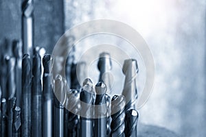 The group of used endmill tools in the light blue scene.