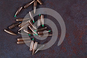 Group of various bullets on dark background.