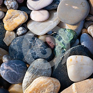 A group of various colorful stones direct sunlight
