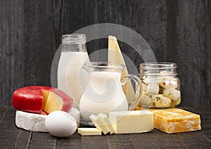 Group of Various Dairy Foods on a Rustic Wooden Table