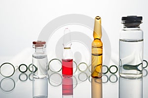 Group of vials with medication on blue methacrylate table. photo