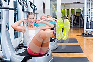 Group on vibrating plates in gym training