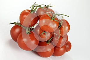 Group Of Vine Ripened Tomatoes On The Vine