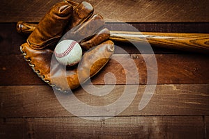 Vintage baseball gear on a wooden background