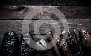 Vintage baseball gear on a wooden background