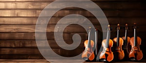 group of violins on a wooden background