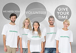 Group of volunteers standing in front of Volunteer graphics